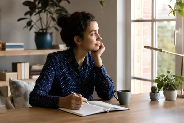 Adult reflecting in a journal